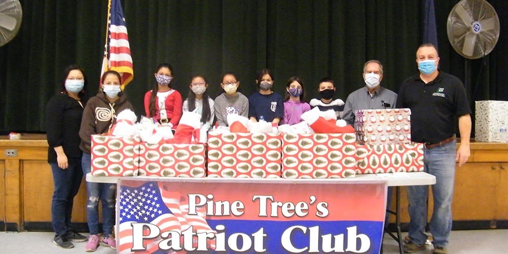 Patriot Club students stuff stockings for troops
