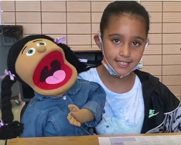 Izabella and her puppet Jazmine