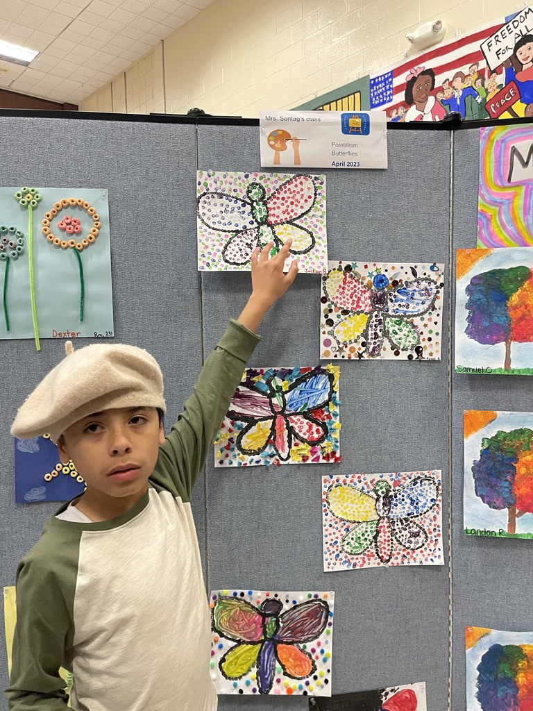 Student shows off art work